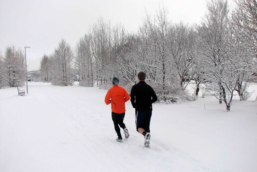 men jogging in winter