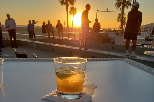 cocktail-on-table-with-sunset